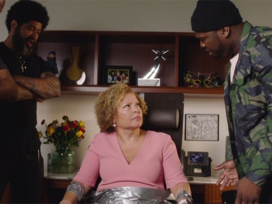 50 Cent interrogates an elderly woman in a sketch during 50 Central