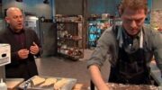 Bobby Flay and a contestant work together on Beat Bobby Flay