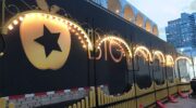 Big Apple Circus Day Time Black and Gold Truck Sign