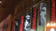 Banners hang from the side of the Ambassador Theatre which houses Chicago the Musical