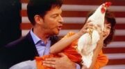 Harry Connick Jr. holds a chicken on his daytime program