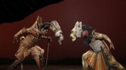 Scar and Mufasa fight in the Lion King on Broadway