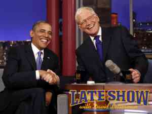 Late Show host David Letterman shakes hands with President Barack Obama