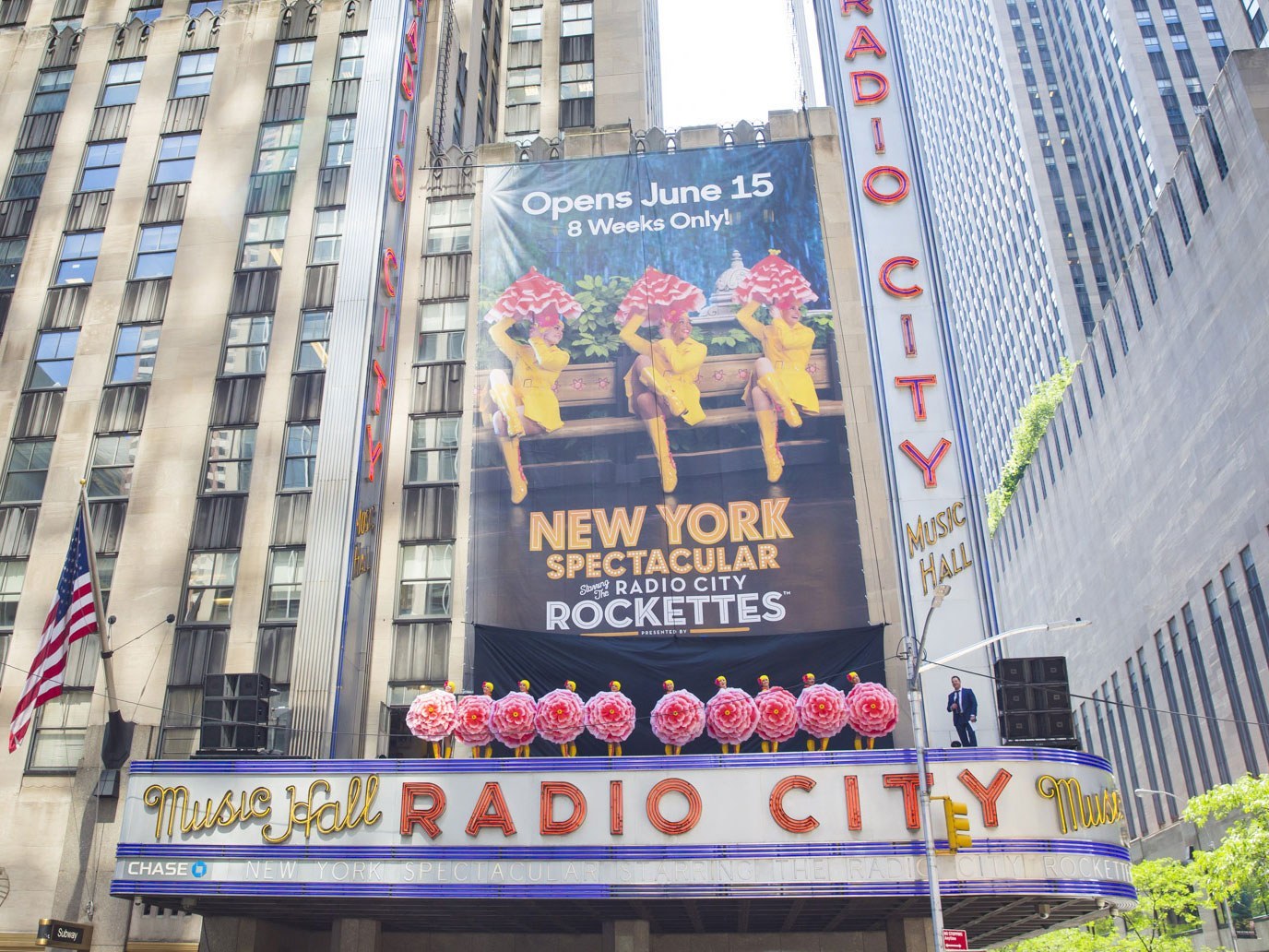 Rockettes stand atop the Radio City Music Hall marquee